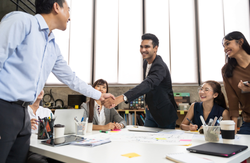 Asian,Business,People,Smart,Casual,Wear,Shaking,Hands,While,Working