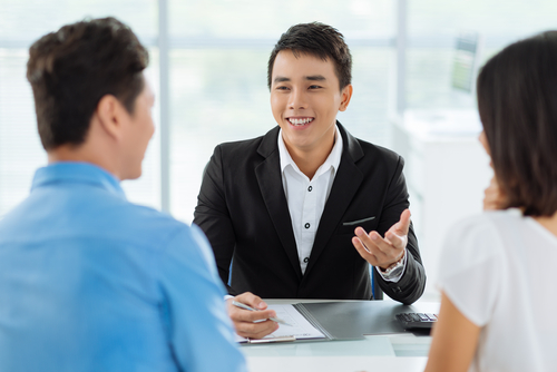 Cheerful,Vietnamese,Sales,Manager,Giving,Advice,To,His,Clients